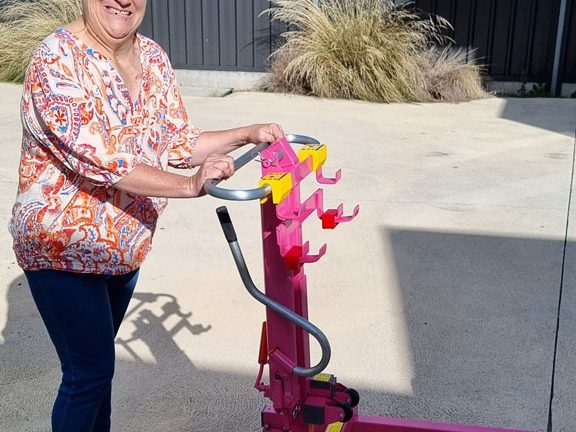 Jacy and her bright pink bin dozer