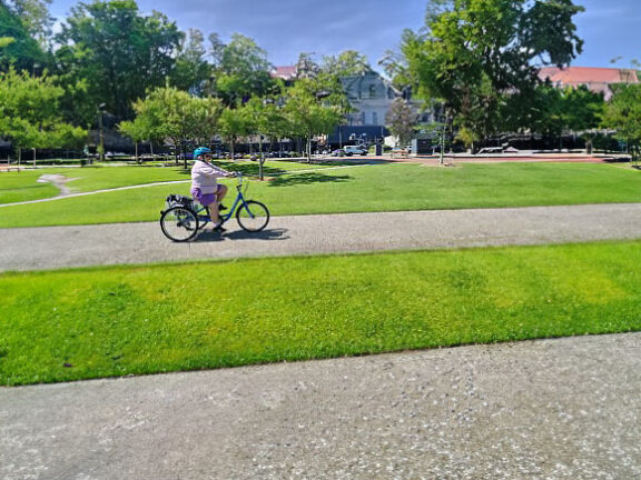 A person riding her freedom wheels bike at Willunga