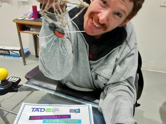 Happy participant in the pottery, art, and crafts class.
